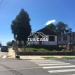 Terreno à venda no centro de Canela com duas casas